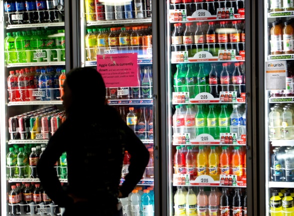 Student looks through the many choices of soft drink available at the Memorial Union